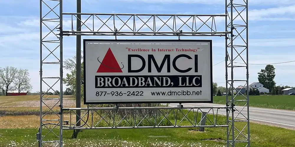 The DMCI Broadband sign beside the road in Reading, Michigan
